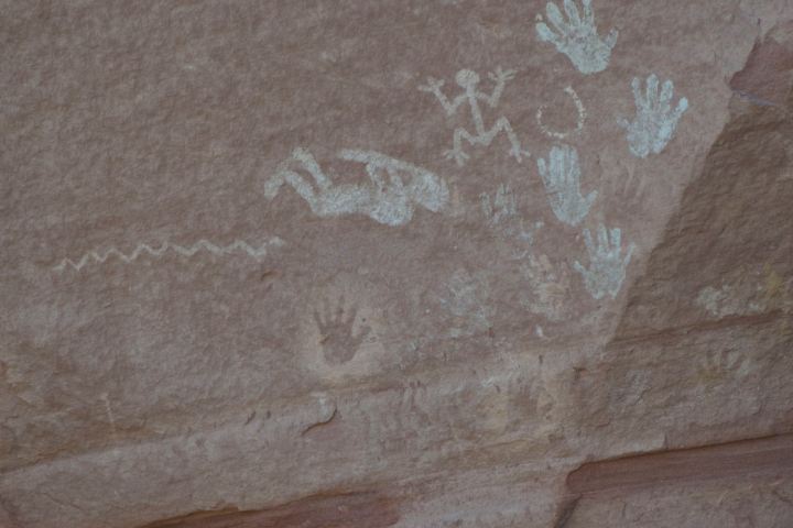 Wall paintings of figures and hands